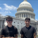Two students standing outside Capitol building
